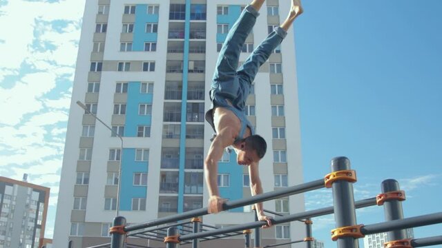 A man exercising on a sports ground