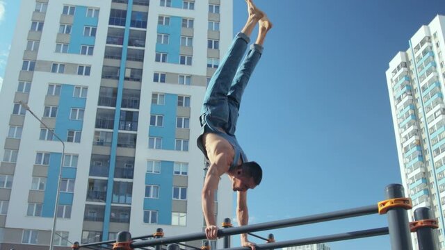 A man exercising on a sports ground
