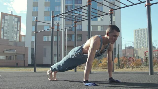 A man exercising on a sports ground
