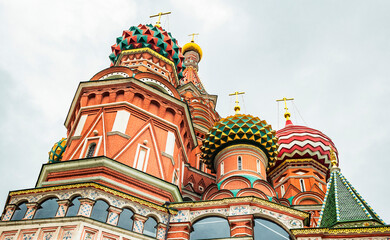 Fototapeta na wymiar The Cathedral of Vasily the Blessed, elements of the facade, domes and Orthodox crosses