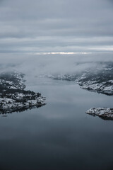 misty morning over snow covered sea landscape, swedish archipelago during winter
