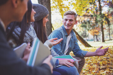 Fototapeta premium Students in autumn park