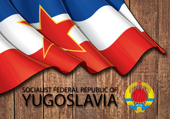 Flag and emblem of the Socialist Federal Republic of Yugoslavia on a wooden background