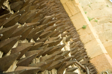 iron spikes mounted on an old castle door