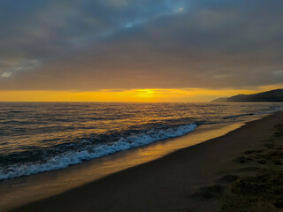 evening november sky with sunset over mediterranean sea/beach  at autumn
