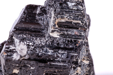 macro mineral stone sherle, schorl, black tourmaline on white background