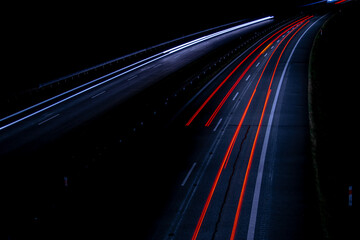 Night road lights. Lights of moving cars at night. long exposure red, blue, green, orange.