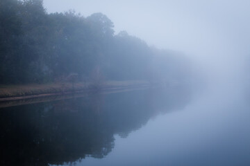 Fototapeta premium Foggy morning at the lake.