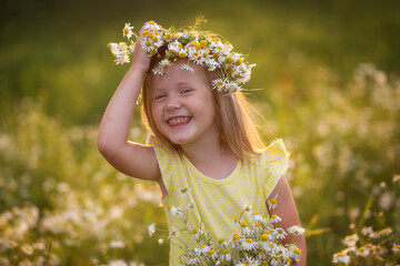 little girl in a field of flowers