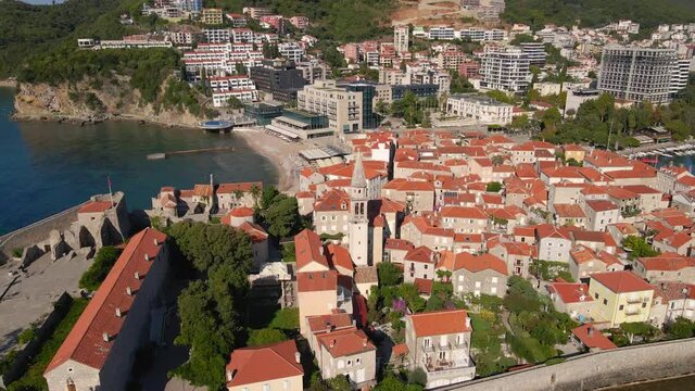 Aerial video. Slowmotion shot. The Old Town of the city of Budva popular tourist destination in Montenegro