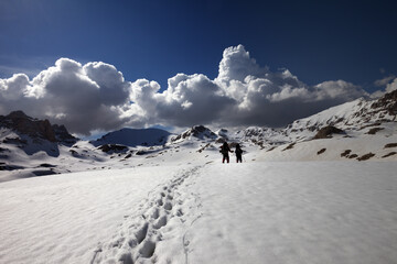 Hikers on snow plateau