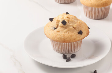 Chocolate chip muffins on the marble surface. - 476912141