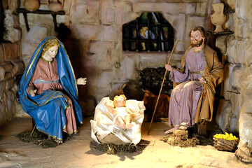 Fototapeta na wymiar Nativity scene. Figures of the Child Jesus, the Virgin Mary and St. Joseph. 