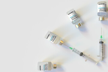 Clock face made with anthrax vaccine vials and syringes. Vaccination time concept. Conceptual medical 3D rendering