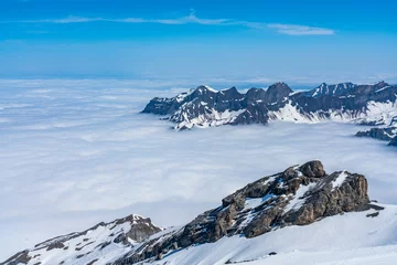 Fotobehang Switzerland, Panoramic view on Snow Alps and Blue Sky around Titlis mountain © AlehAlisevich