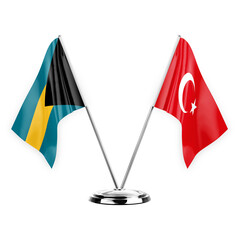 Two table flags isolated on white background 3d illustration, bahamas and turkey