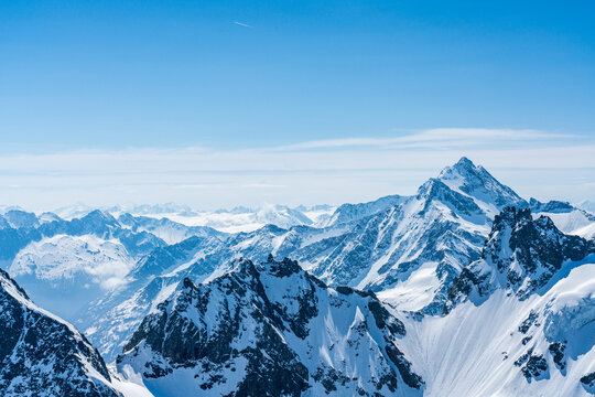 Switzerland, Panoramic view on Snow Alps and Blue Sky around Titlis mountain