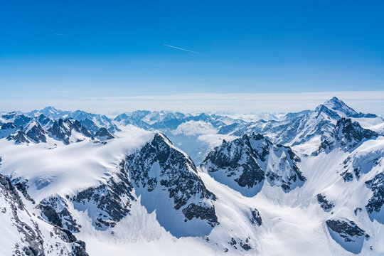 Switzerland, Panoramic view on Snow Alps and Blue Sky around Titlis mountain