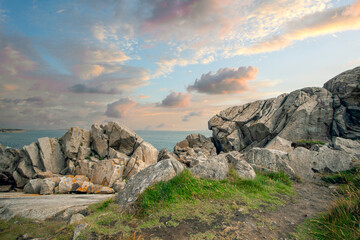 Dalkey cliffs and rocks seashore in sunny day, rocks on the seashore, Dublin county, Ireland