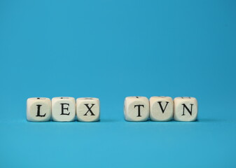 Slogan LEX TVN isolated on blue background close up