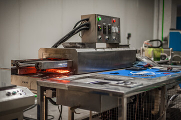 Closeup view of automatic heater stove heating PVC machine in factory