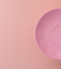 half pink plate on a pink background