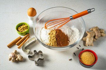 Gingerbread ingredients and accessories for making ginger dough.