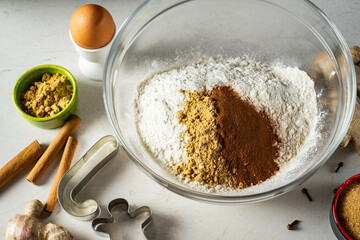 Gingerbread ingredients and accessories for making ginger dough.