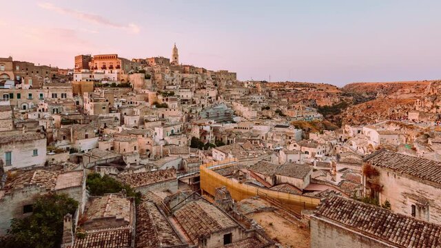 Sassi of Matera during summer sunset with tourists, Timelapse 4K