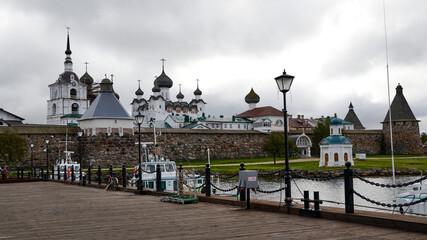 Fototapeta na wymiar Russia. Solovetsky Islands. View of the Bay of Prosperity and the Solovetsky Monastery from the Monastery pier