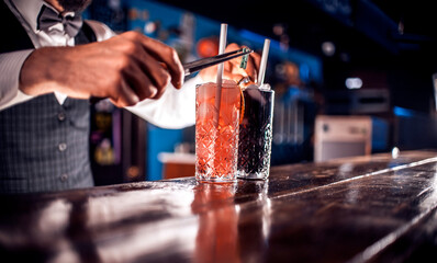 Bartender makes a cocktail at the beerhouse