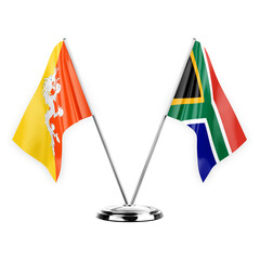 Two table flags isolated on white background 3d illustration, bhutan and south africa