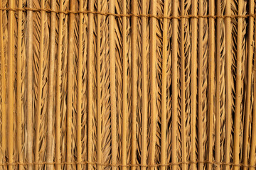 Reed mat texture. Wicker grass rug
