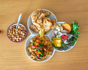 Ceviche with seafood rice and fish chicharron. Peruvian food, seafood trio.