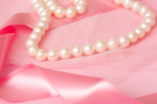 Beautiful pearl necklace on cloth.