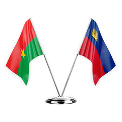 Two table flags isolated on white background 3d illustration, burkina faso and liechtenstein