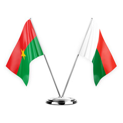 Two table flags isolated on white background 3d illustration, burkina faso and madagascar