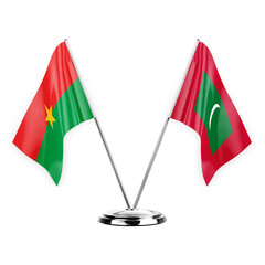 Two table flags isolated on white background 3d illustration, burkina faso and maldives