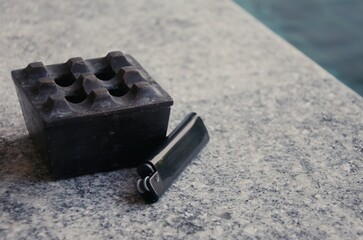 Ashtray and lighter. Healthy lifestyle concept.