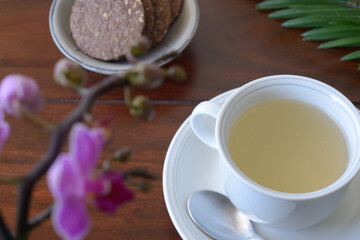 Cup Herbal tea and Chocolate oat cookies