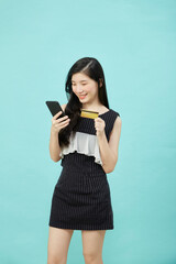 Naklejka premium Beautiful Asian woman shopping online