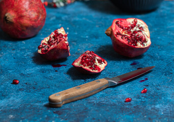 Pomegranate. cutting of pomegranate on blue background