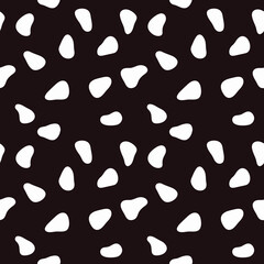 White shapeless spots on a black background. Vector with seamless spots.