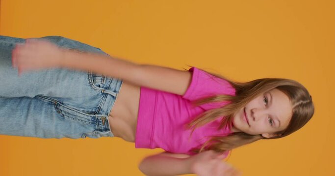 Trendy dancing child girl vlogger cool fast moving, record videostream for social network. Vertical dance video