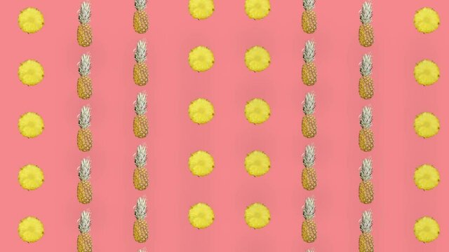 Colorful fruit pattern of fresh pineapple on pink background. Seamless pattern with pineapple sliced. Realistic animation. 4K video motion