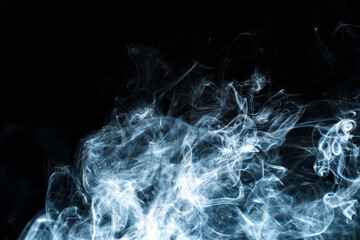 Photo of a wisp of smoke on a dark background