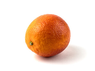 Fresh blood orange with soft shadow isolated on a white background side view