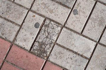 Background image of texture of pedestrian footpath covered by paving tiles