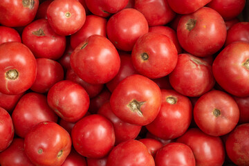 There are fresh tomatoes on the table