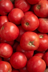 There are fresh tomatoes on the table